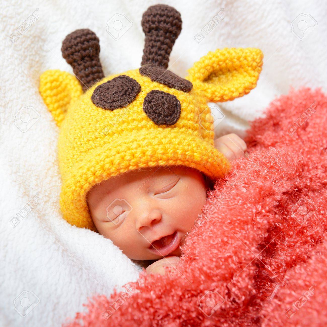 Cute Baby Sleeping In Funny Yellow Giraffe Hat And Smiling In Sweet Dreams Beautiful Kids Cute Baby Sleeping In Funny Yellow Giraffe Hat And Smiling In Sweet Dreams Beautiful Kids