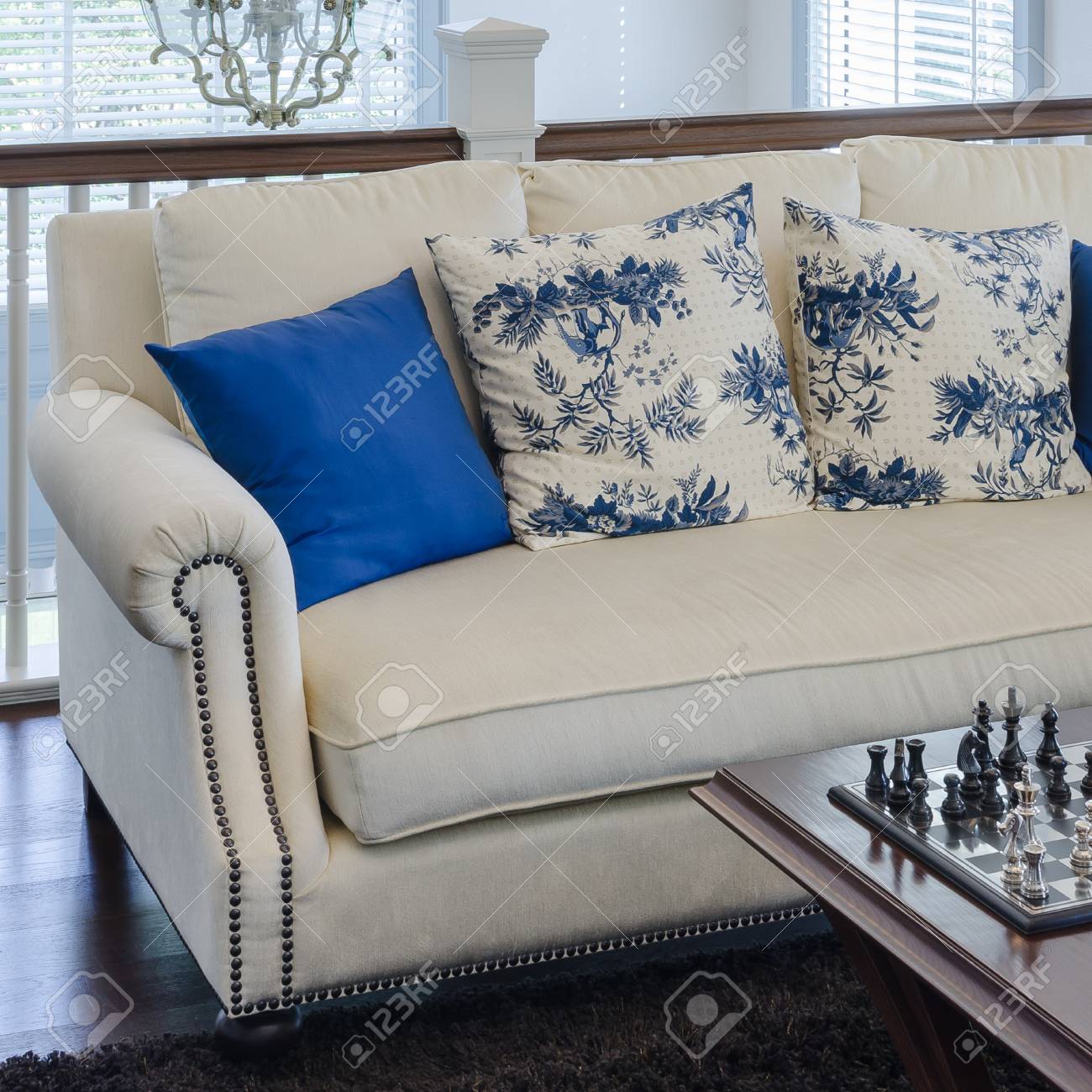 Luxury Sofa With Blue Pillow On Brown Carpet In Living Room At Stock Photo Picture And Royalty Free Image Image 34873865