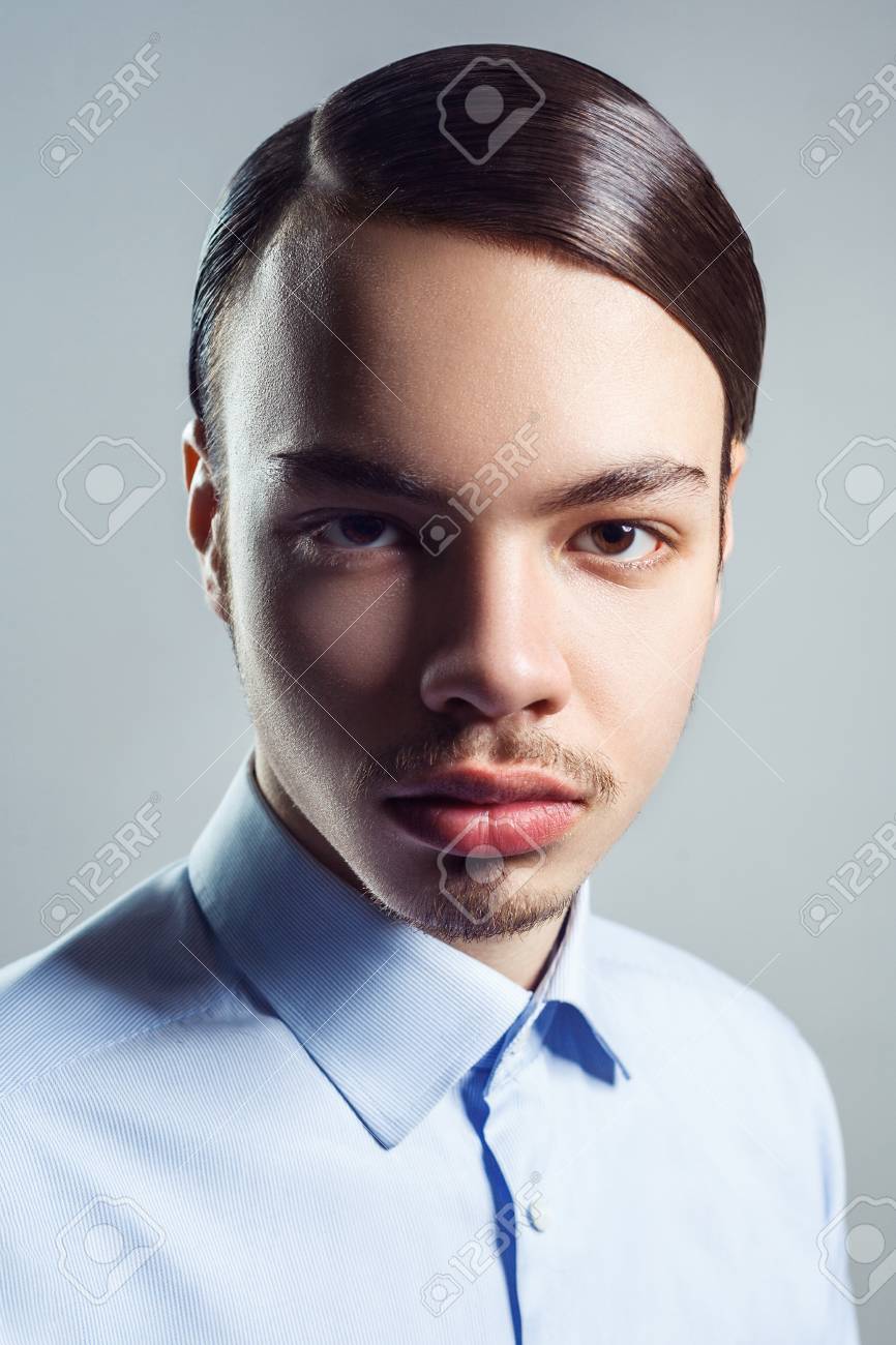 Portrait Of Young Man With Retro Classic Hairstyle. Studio Shot. Looking At Camera. Stock Photo, Picture And Royalty Free Image. Image 77836208. Portrait Of Young Man With Retro Classic Hairstyle. Studio Shot. Looking At Camera. Stock Photo, Picture And Royalty Free Image. Image 77836208.