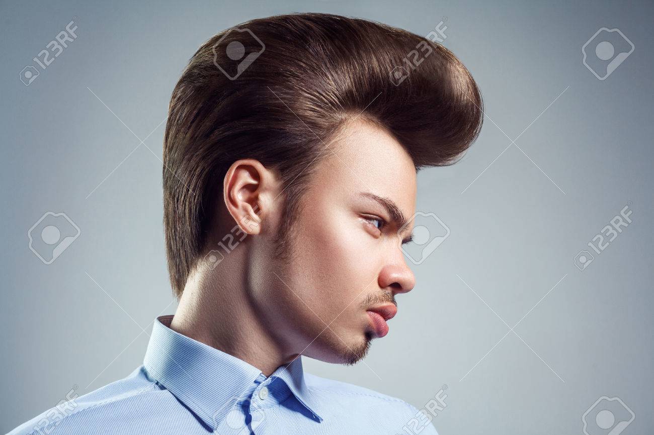 side view of young man with retro classic pompadour hairstyle