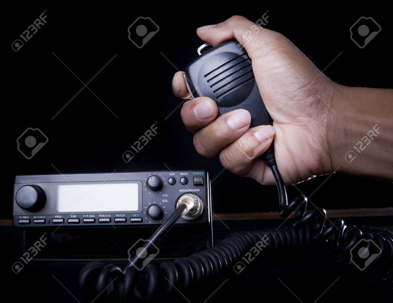 hand of Amateur radio holding speaker and press for radio communication theme - 20411426 hand of Amateur radio holding speaker and press for radio communication theme - 20411426