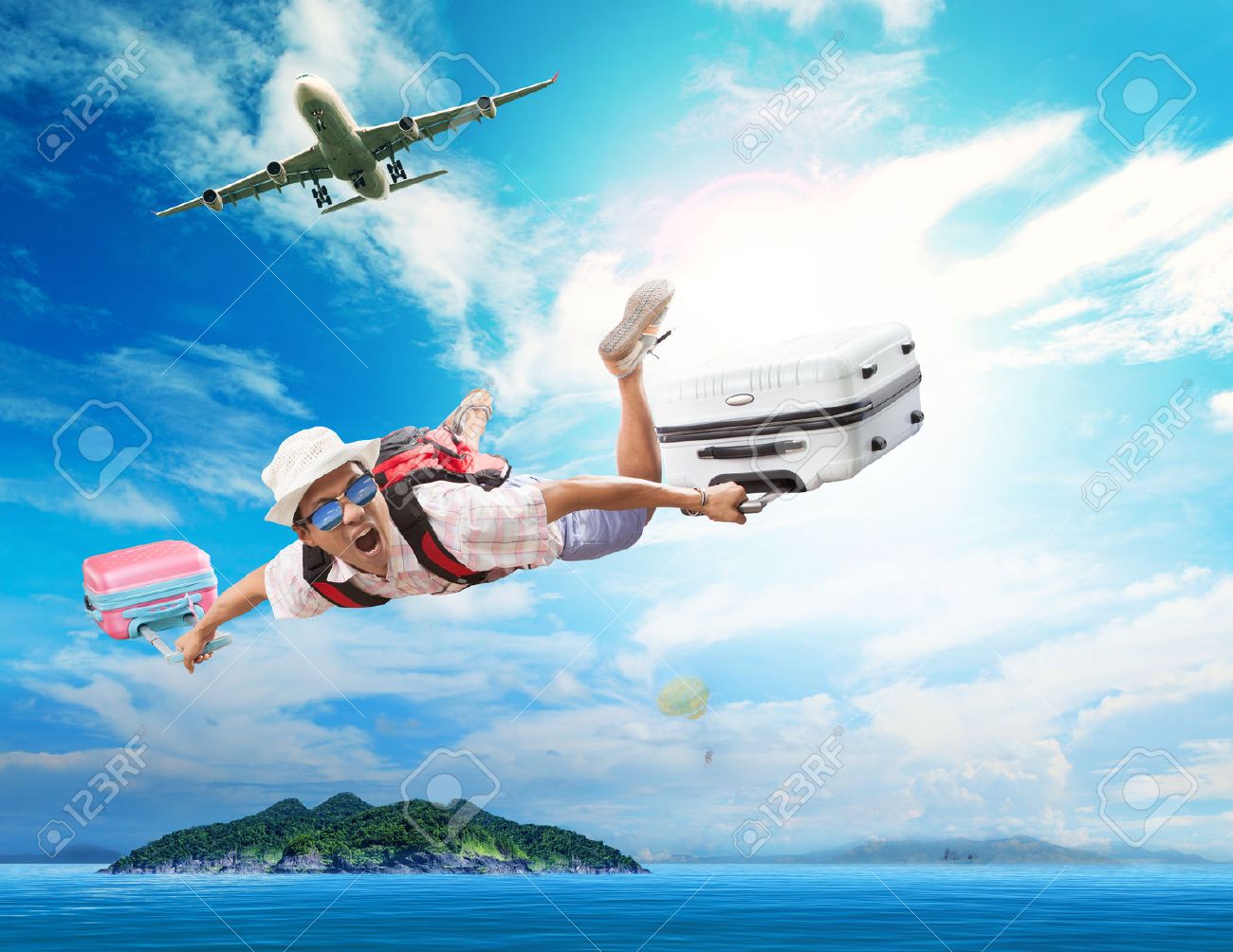 young man flying from passenger plane to natural destination island on blue ocean with happiness face emotion use for people traveling on vacation holiday in summer season - 39903089 young man flying from passenger plane to natural destination island on blue ocean with happiness face emotion use for people traveling on vacation holiday in summer season - 39903089