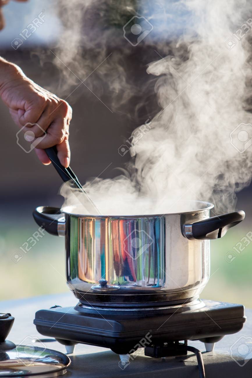 Hand Cooking On Hot Pot With Water Steam Stock Photo Picture And Royalty Free Image Image 84167434