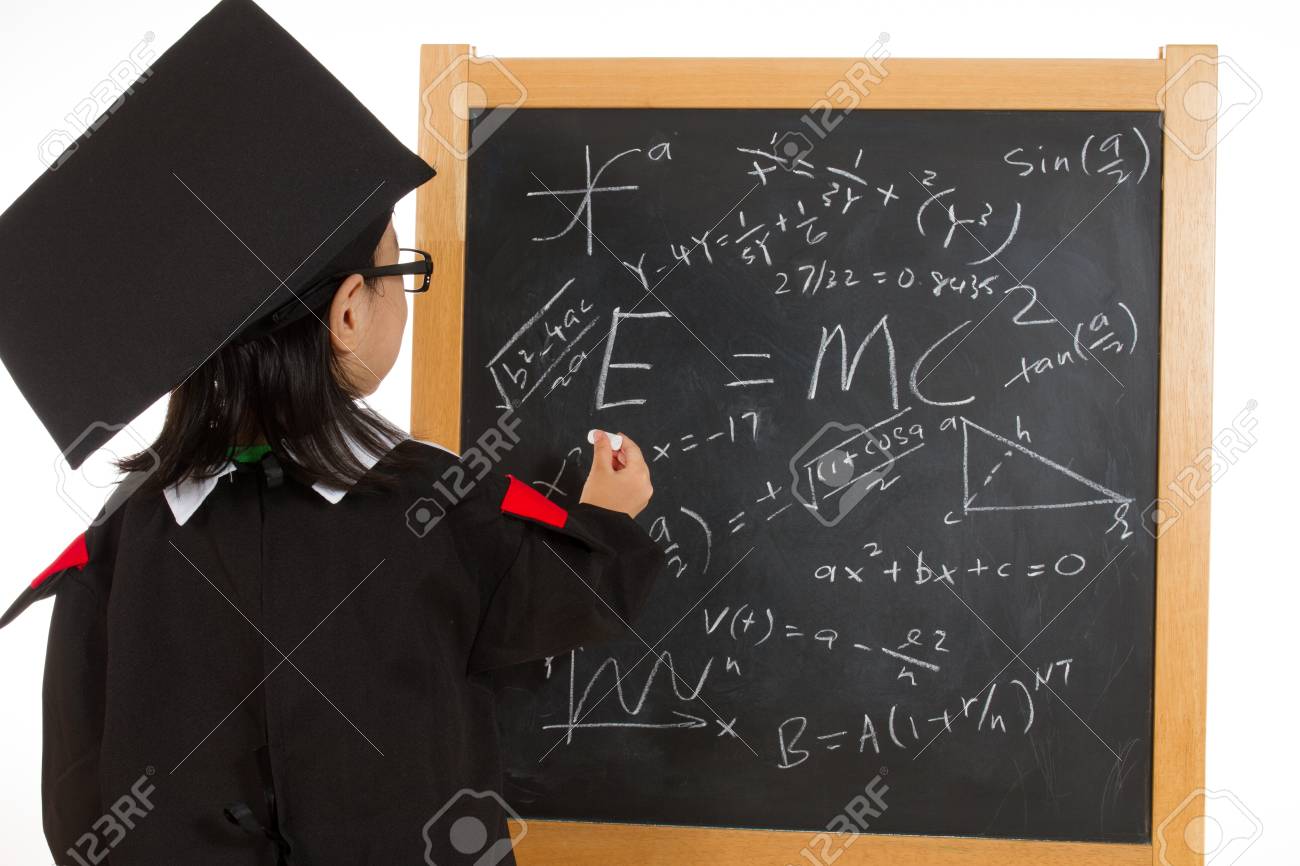 asian chinese children in graduation gown againts blackboard stock