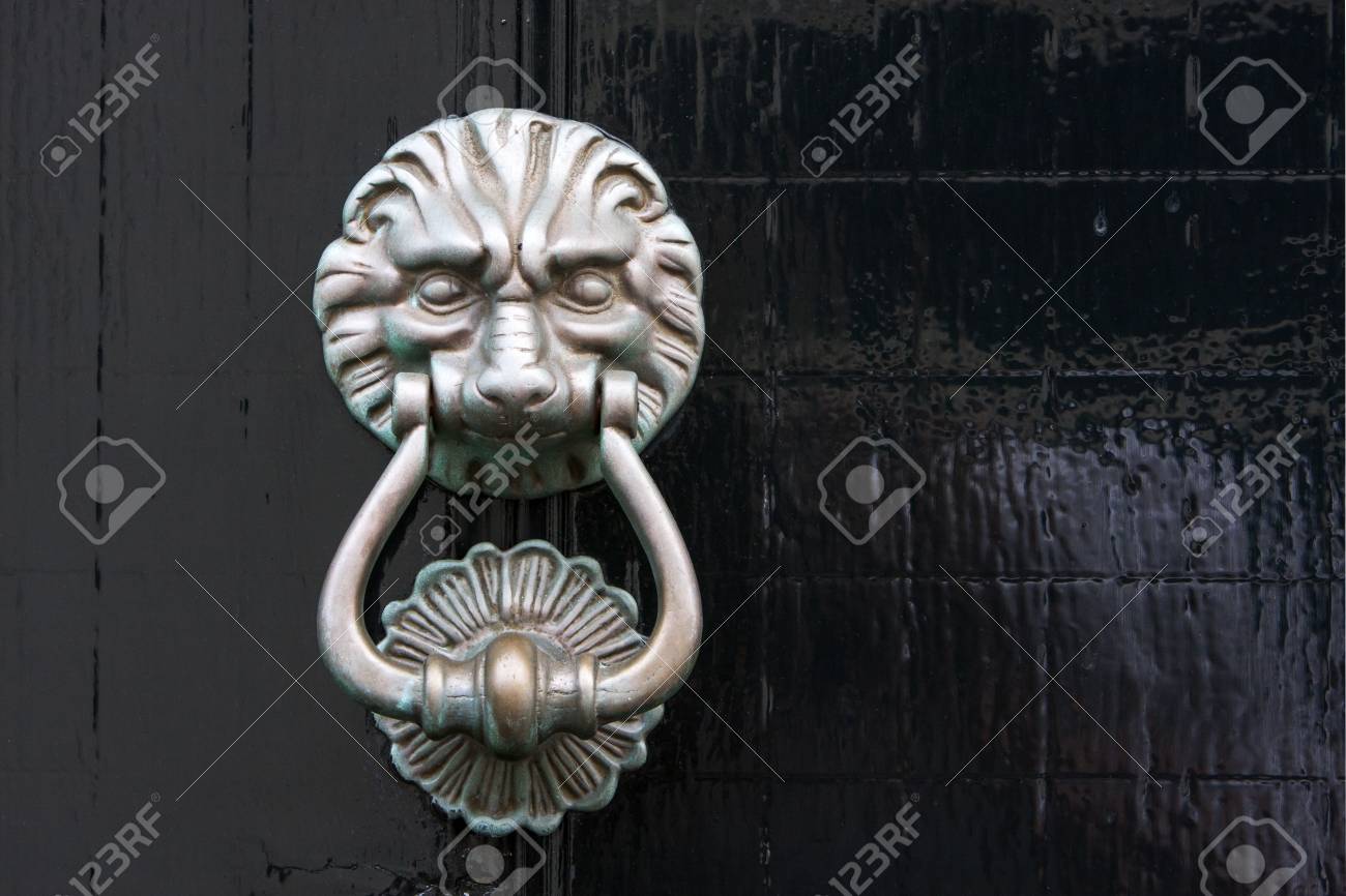 Antique Lion Door Knocker On A Black Wooden Door In The Netherlands Antique lion door knocker on a black wooden door in the Netherlands Stock Photo - 65828609 - Antique Lion Door Knocker On A Black Wooden Door In The Netherlands