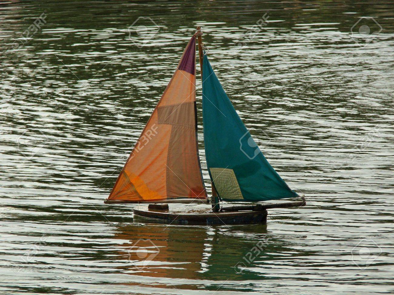 toy boat in a lake stock photo picture and royalty free image