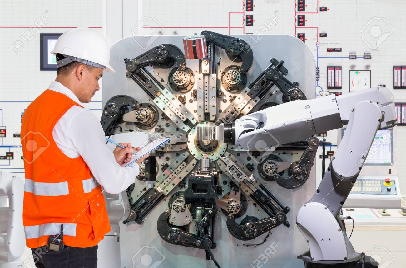 engineer checking maintenance daily of automated robotic in robotic engineering