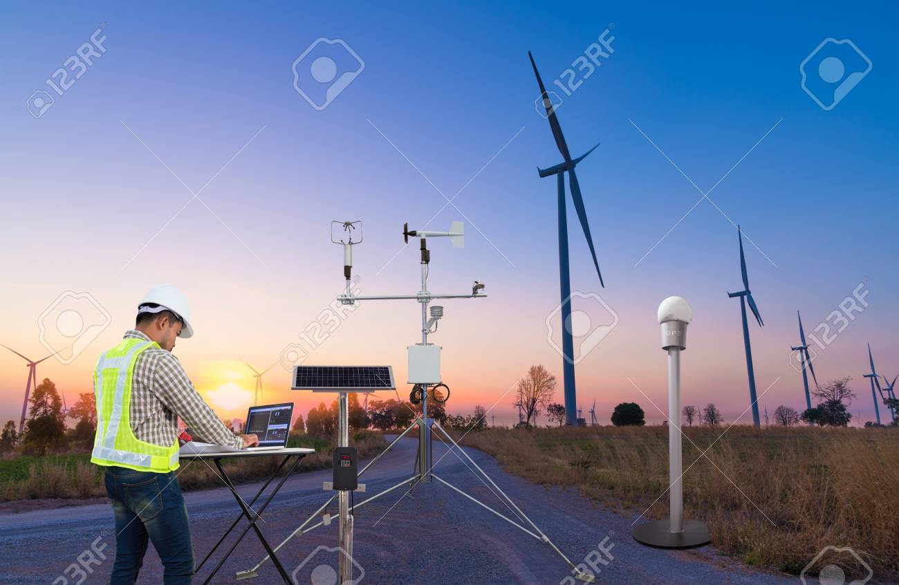 Engineer using laptop computer collect data with meteorological instrument to measure the wind speed, temperature and humidity and solar cell system on wind turbine station, Smart agriculture technology concept - 120505678 Engineer using laptop computer collect data with meteorological instrument to measure the wind speed, temperature and humidity and solar cell system on wind turbine station, Smart agriculture technology concept - 120505678