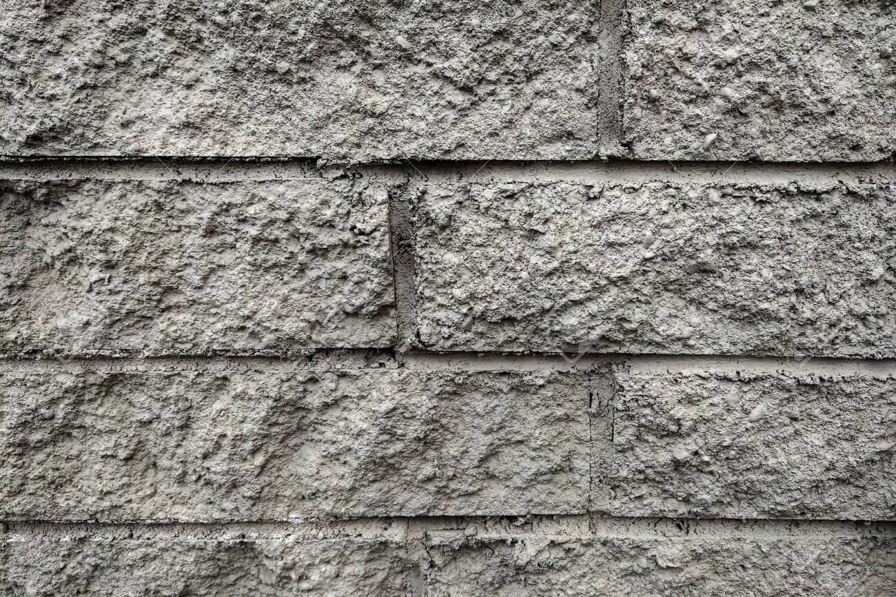 the grey wall surface uses a lot of bricks or old black brick uses for a brick