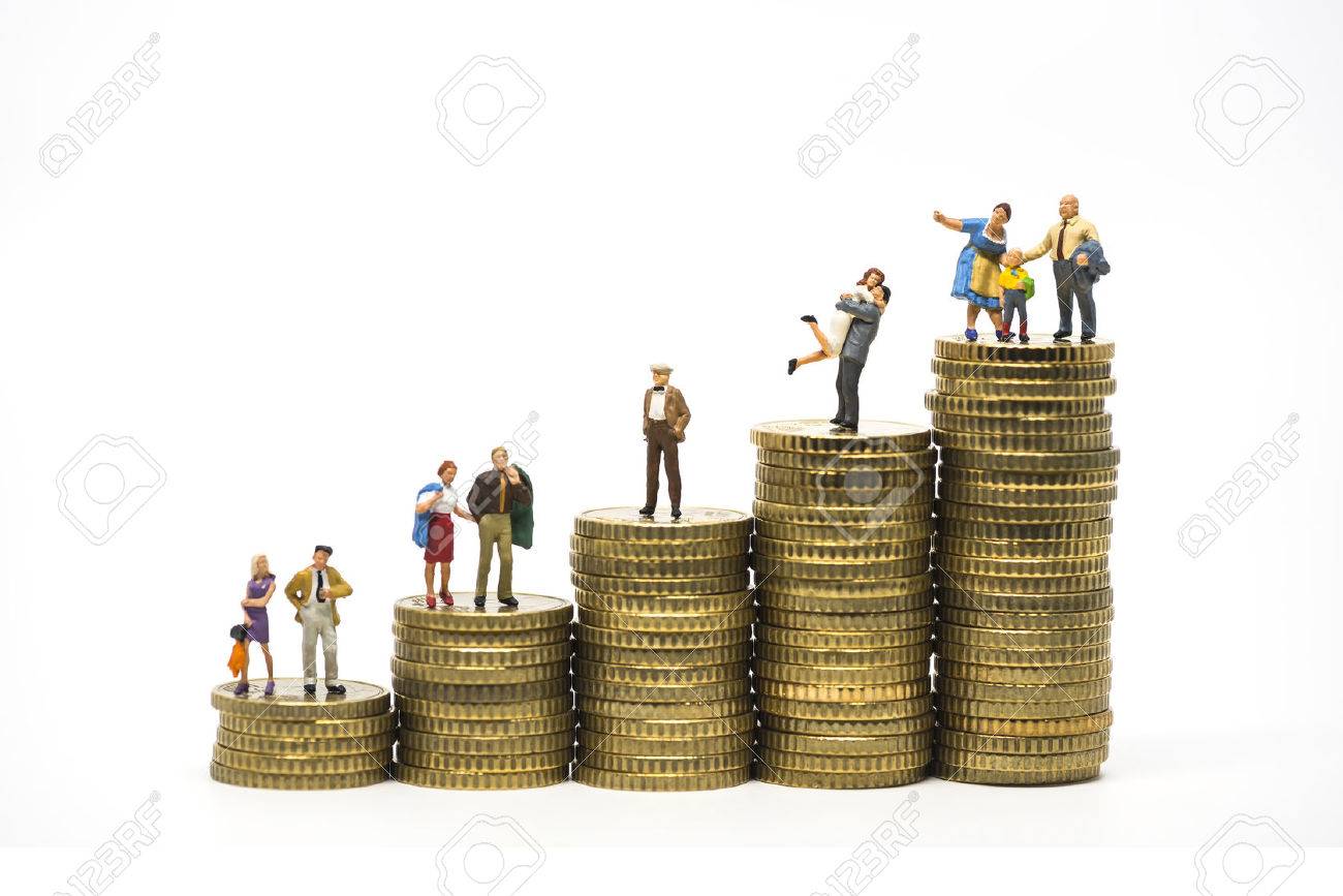 Faily budget concept. Miniature family on coins pile. Macro photo - 56220838 Faily budget concept. Miniature family on coins pile. Macro photo - 56220838