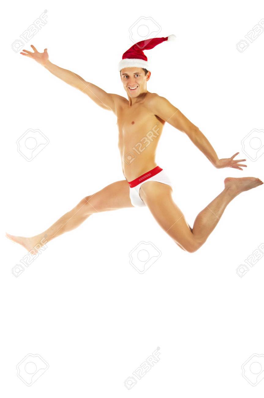 面白い人物 X Mas 赤い帽子のジャンプします 白で隔離されます の写真素材 画像素材 Image