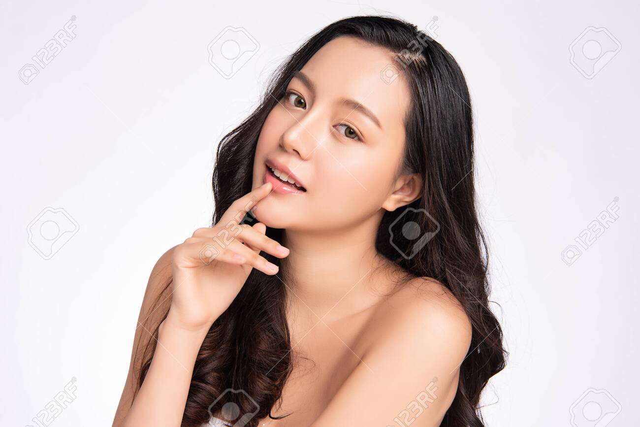 Beautiful young asian woman with clean fresh skin on white background, Face care, Facial treatment, Cosmetology, beauty and spa, Asian women portrait - 155051167 Beautiful young asian woman with clean fresh skin on white background, Face care, Facial treatment, Cosmetology, beauty and spa, Asian women portrait - 155051167