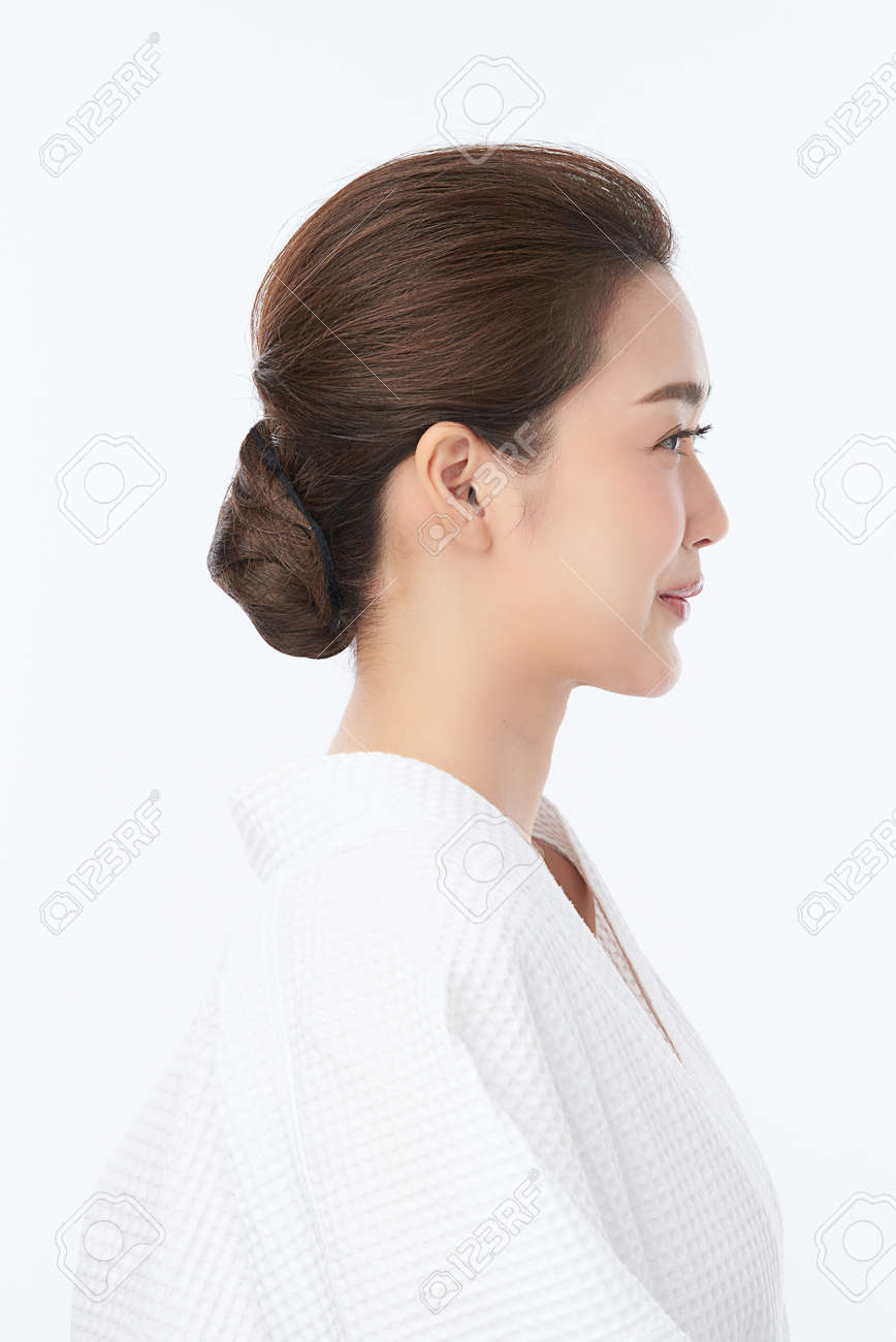 Beautiful young Asian woman wearing bathrobe on white background, Face care, Facial treatment, Cosmetology, beauty and spa Concept. - 168228135 Beautiful young Asian woman wearing bathrobe on white background, Face care, Facial treatment, Cosmetology, beauty and spa Concept. - 168228135