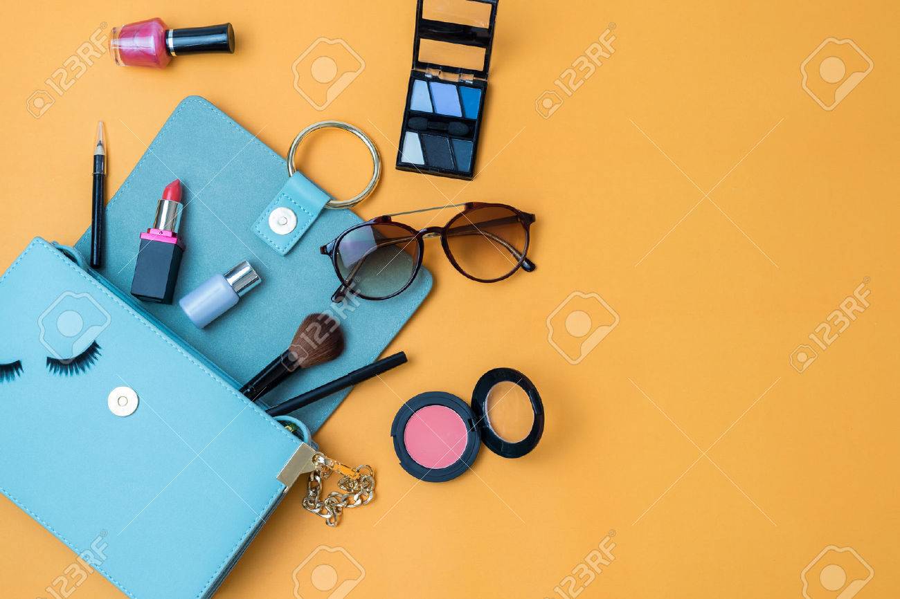 Fashion woman essentials, cosmetics, cellphone, makeup accessories on colorful background, Top view - 63831386 Fashion woman essentials, cosmetics, cellphone, makeup accessories on colorful background, Top view - 63831386