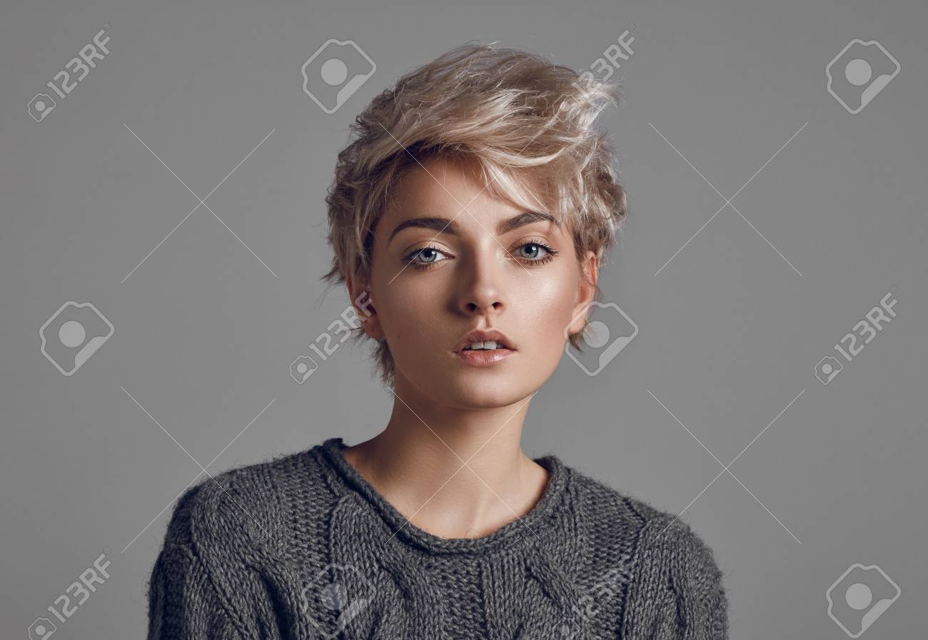 Fashion Portrait Of Young Woman With Blond Short Hair Isoalted