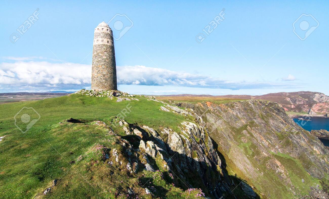 A large rock tower sits on a grassy field at the tip of the Oa Peninsula on the island of Islay in Scotland. - 120150809 A large rock tower sits on a grassy field at the tip of the Oa Peninsula on the island of Islay in Scotland. - 120150809