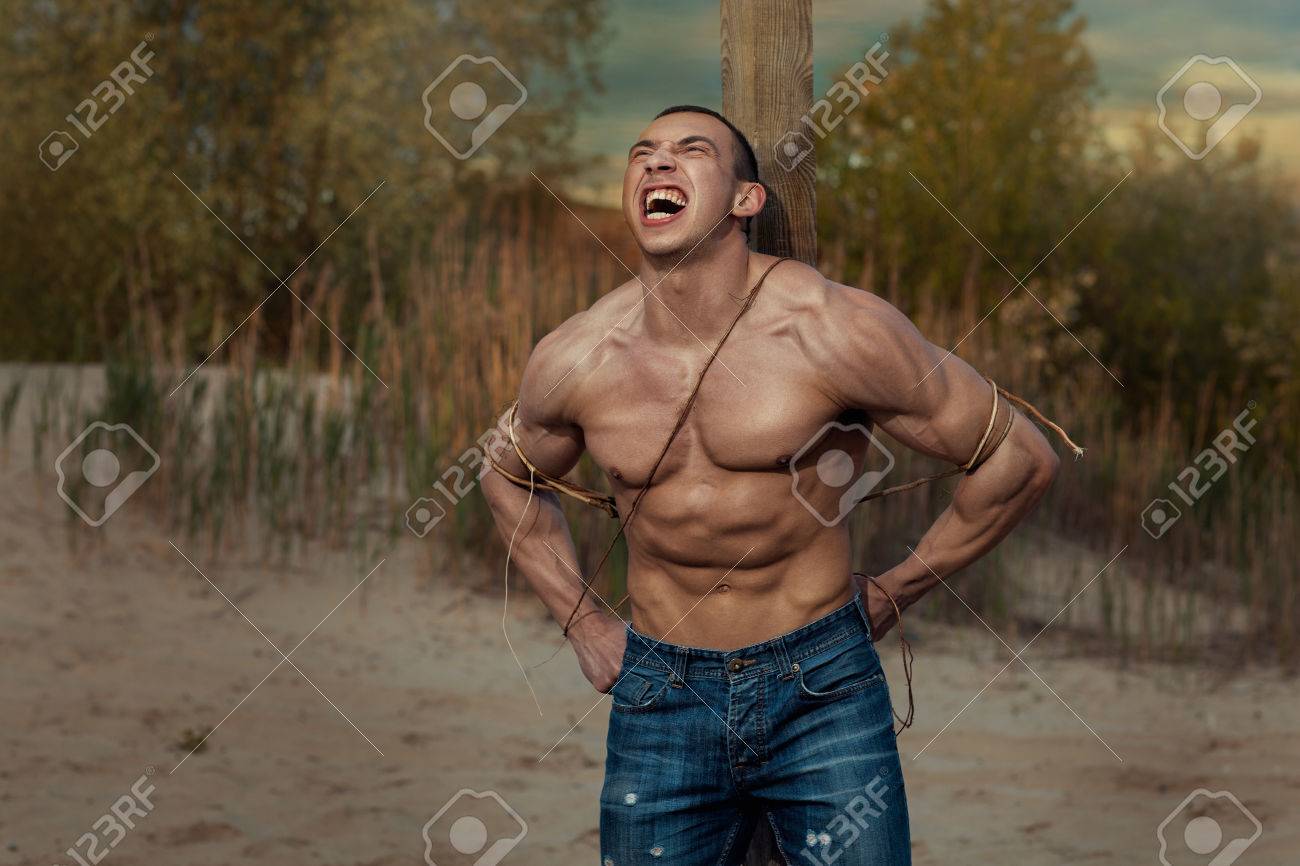 Black dude tied to pole