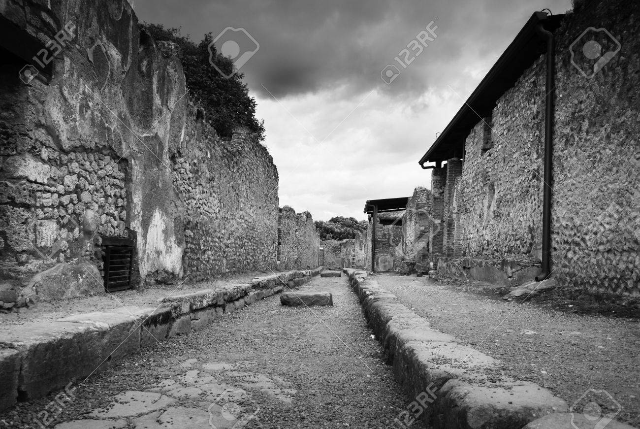 Rare empty street in pompeii italy black and white