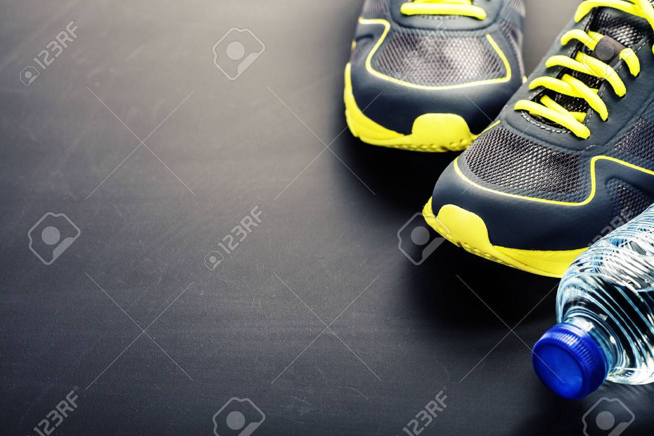 Sport Shoes And Water On Grey Background Stock Photo Picture And