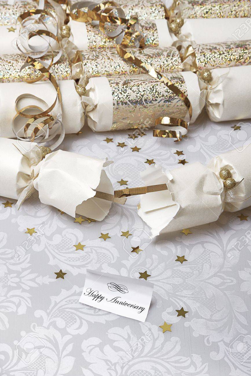 festive party crackers with a happy anniversary note stock photo anniversary note