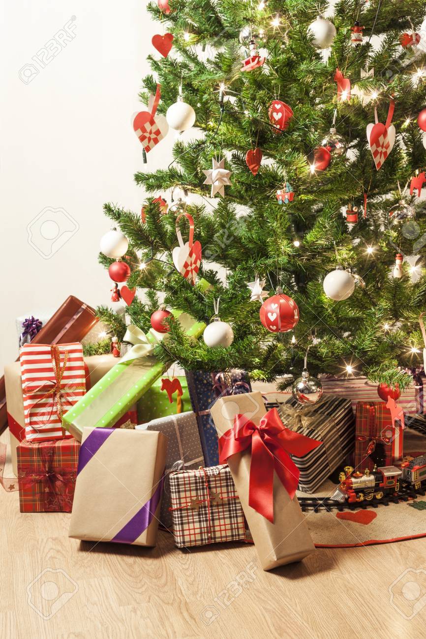 toy train around christmas tree