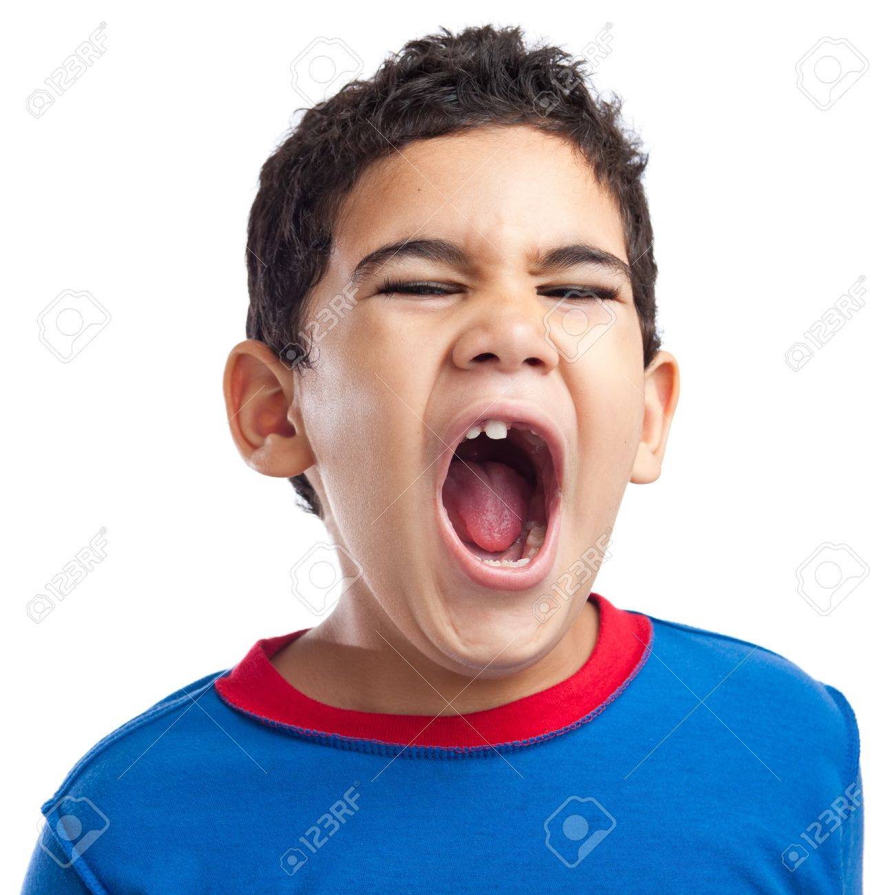 latin boy screaming with anger on a white background stock photo
