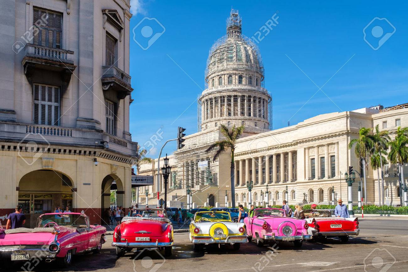 Group of colorful old classic cars near the Capitol in Old Havana - 59428513 Group of colorful old classic cars near the Capitol in Old Havana - 59428513