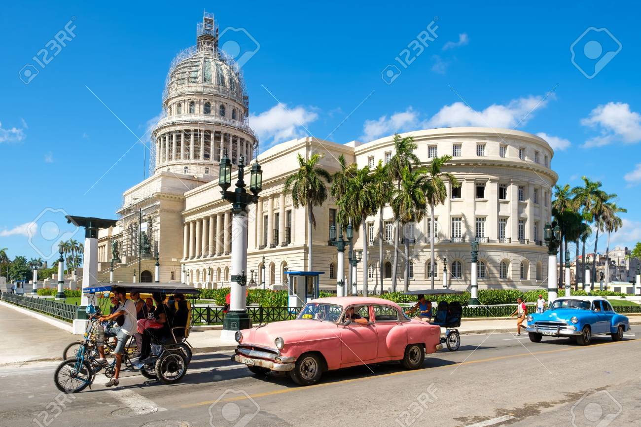 Street scene with classic cars near the Capitol in downtown Havana - 59428514 Street scene with classic cars near the Capitol in downtown Havana - 59428514