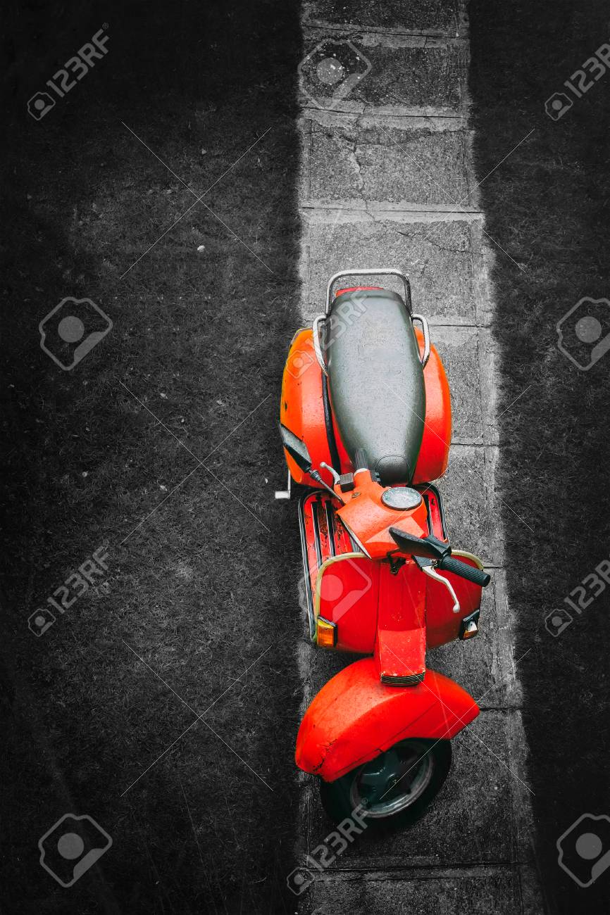 Red vintage italian scooter on a black and white background - 80696311 Red vintage italian scooter on a black and white background - 80696311