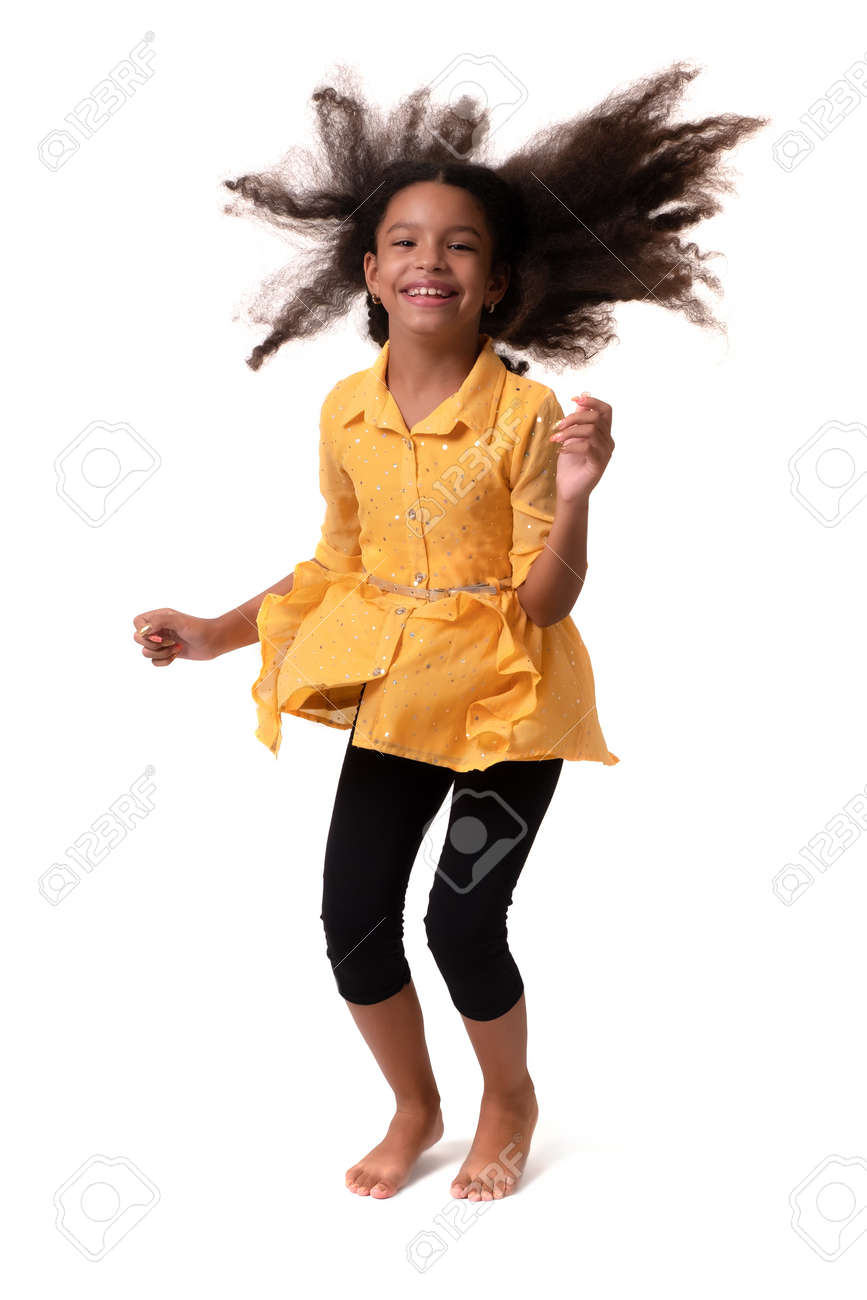 Happy multiracial small girl jumping and laughing - Isolated on white - 159904456 Happy multiracial small girl jumping and laughing - Isolated on white - 159904456