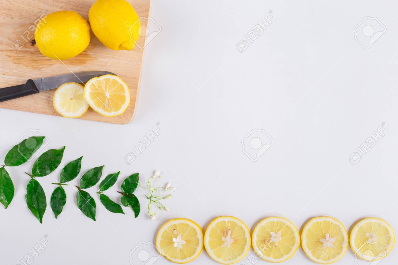 flat lay image of fresh lemon with lemon slice on white background