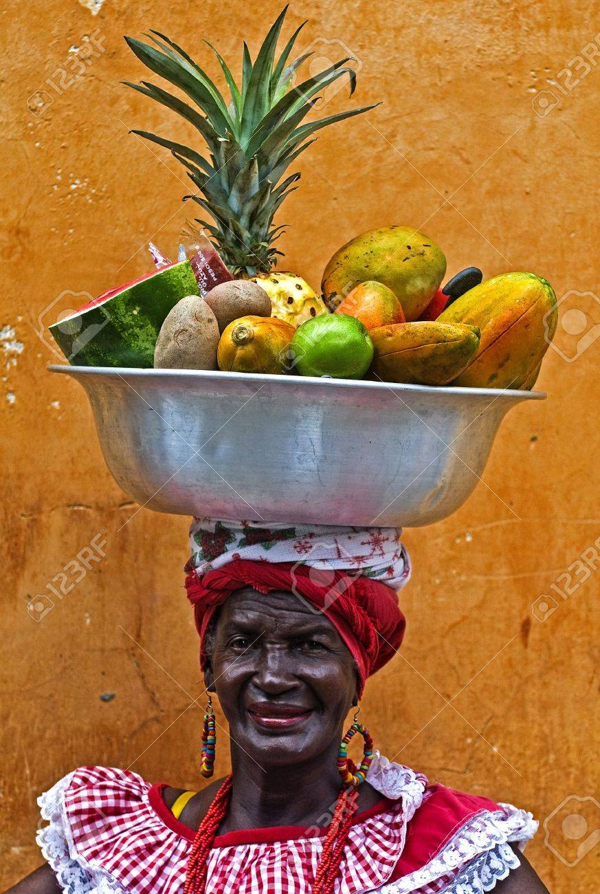 CARTAGENA DE INDIAS , COLOMBIA - DEC 21:Unidentified Palenquera woman sell fruts in Cartagena de Indias on December 21 2010,Palenqueras are a unique African descendat ethnic group found in the north region of South America - 10678051 CARTAGENA DE INDIAS , COLOMBIA - DEC 21:Unidentified Palenquera woman sell fruts in Cartagena de Indias on December 21 2010,Palenqueras are a unique African descendat ethnic group found in the north region of South America - 10678051