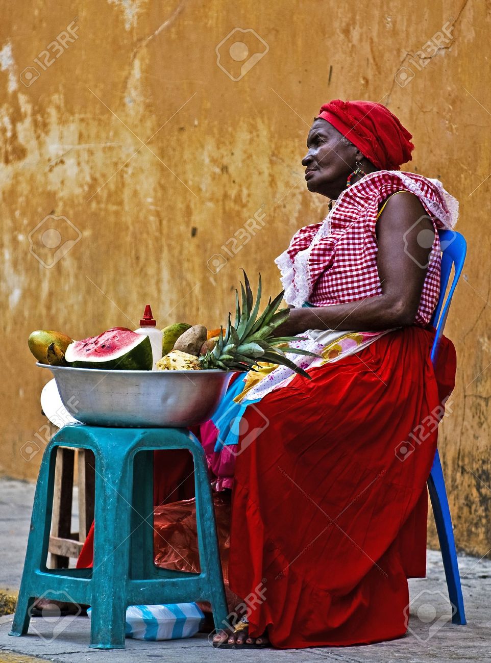 CARTAGENA DE INDIAS , COLOMBIA - DEC 21:Unidentified Palenquera woman sell fruts in Cartagena de Indias on December 21 2010,Palenqueras are a unique African descendat ethnic group found in the north region of South America - 11026008 CARTAGENA DE INDIAS , COLOMBIA - DEC 21:Unidentified Palenquera woman sell fruts in Cartagena de Indias on December 21 2010,Palenqueras are a unique African descendat ethnic group found in the north region of South America - 11026008