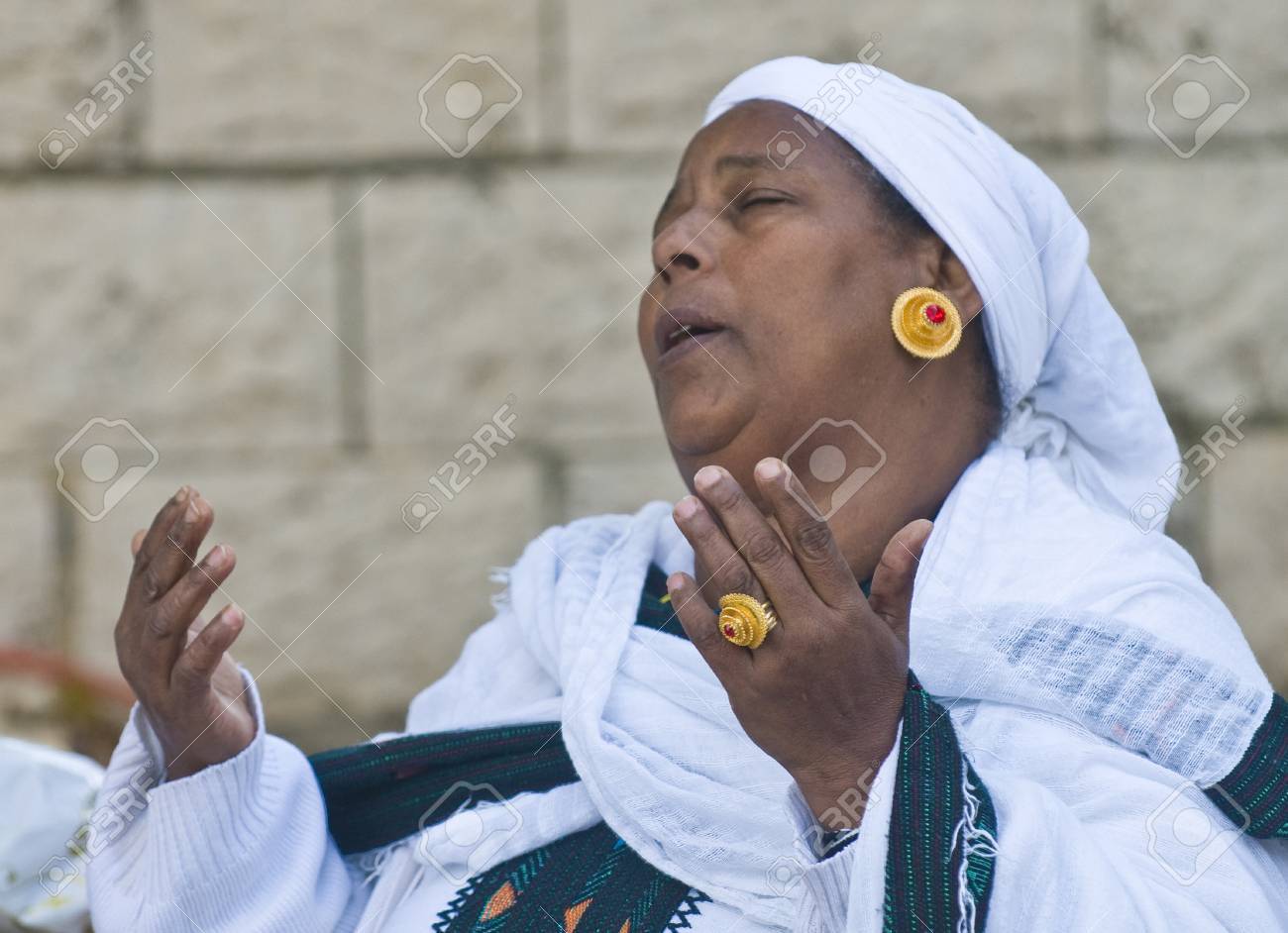 JERUSALEM - NOV 24 : Ethiopian woman prays during the "Sigd" holiday in Jerusalem . Israel on November 24 2011 , The Jewish Ethiopean community celebrates the "Sigd" annualy in Jerusalem - 11305783 JERUSALEM - NOV 24 : Ethiopian woman prays during the "Sigd" holiday in Jerusalem . Israel on November 24 2011 , The Jewish Ethiopean community celebrates the "Sigd" annualy in Jerusalem - 11305783