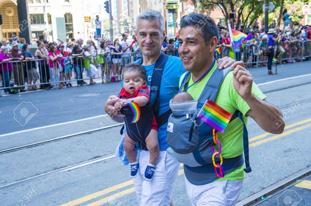 SAN FRANCISCO - JUNE 30 : An unidentified Gay couple participates at the annual San Francisco Gay pride parade on June 30 2013 - 20938355 SAN FRANCISCO - JUNE 30 : An unidentified Gay couple participates at the annual San Francisco Gay pride parade on June 30 2013 - 20938355