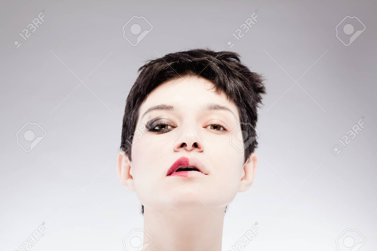 Girl With A Short Hair Having Half Her Face With Make Up Stock