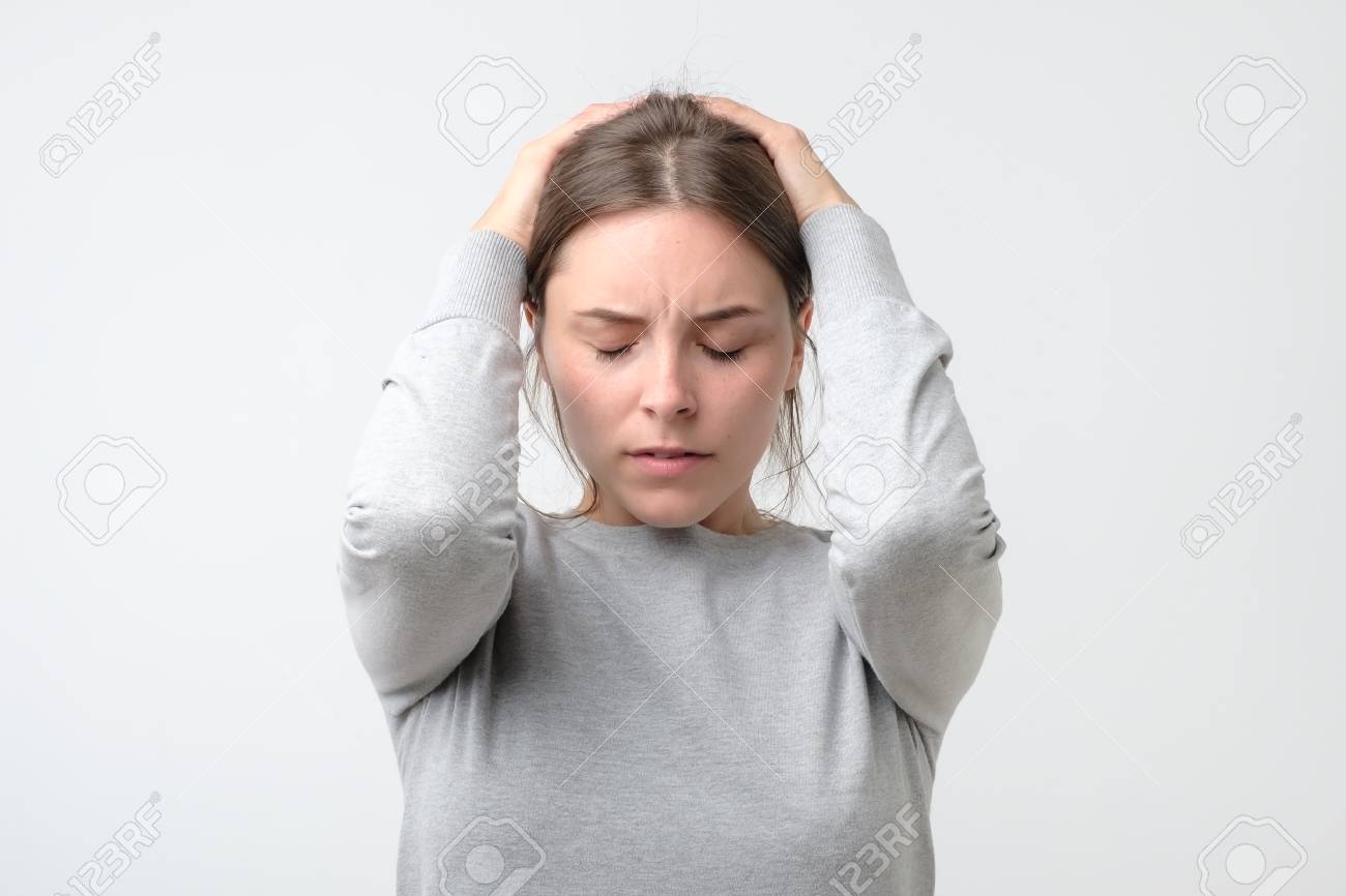 https://previews.123rf.com/images/koldunov/koldunov1901/koldunov190100235/119076714-young-stressed-woman-holding-head-in-hands.jpg?utm_source=chatgpt.com