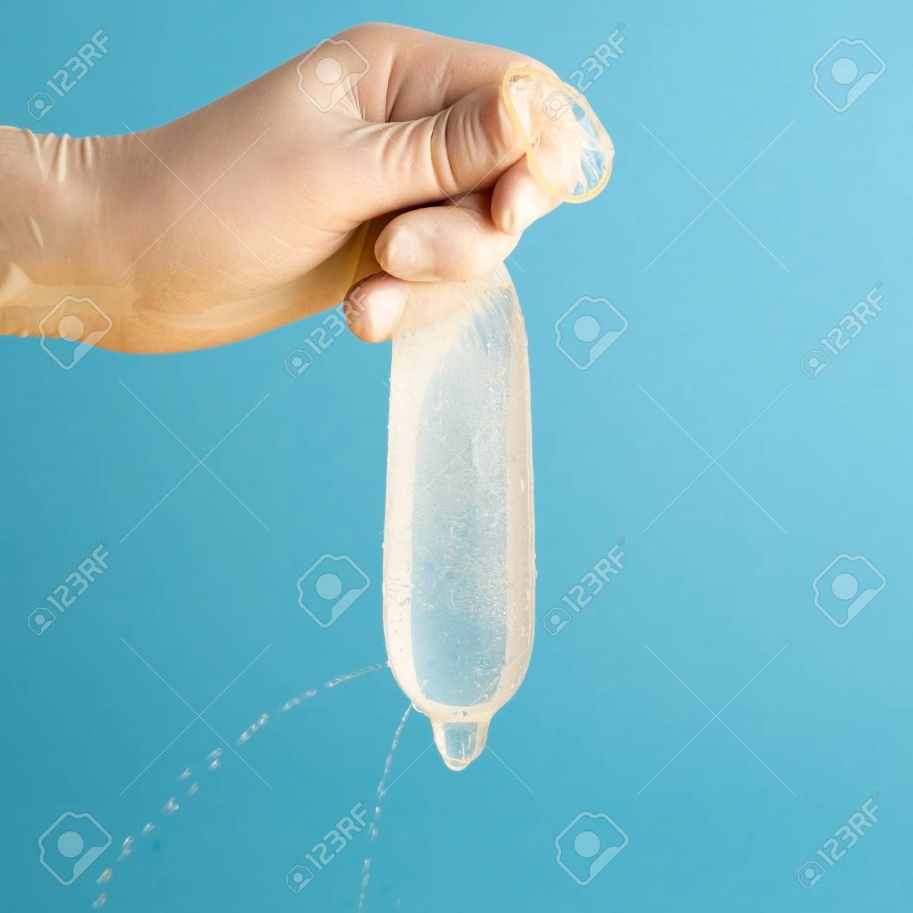 full condom Water Is Leaked From A Condom Full Of Holes. Control Test For The Quality. Danger Of Sexual Disease. Stock Photo, Picture and Royalty Free Image. Image 118658436.