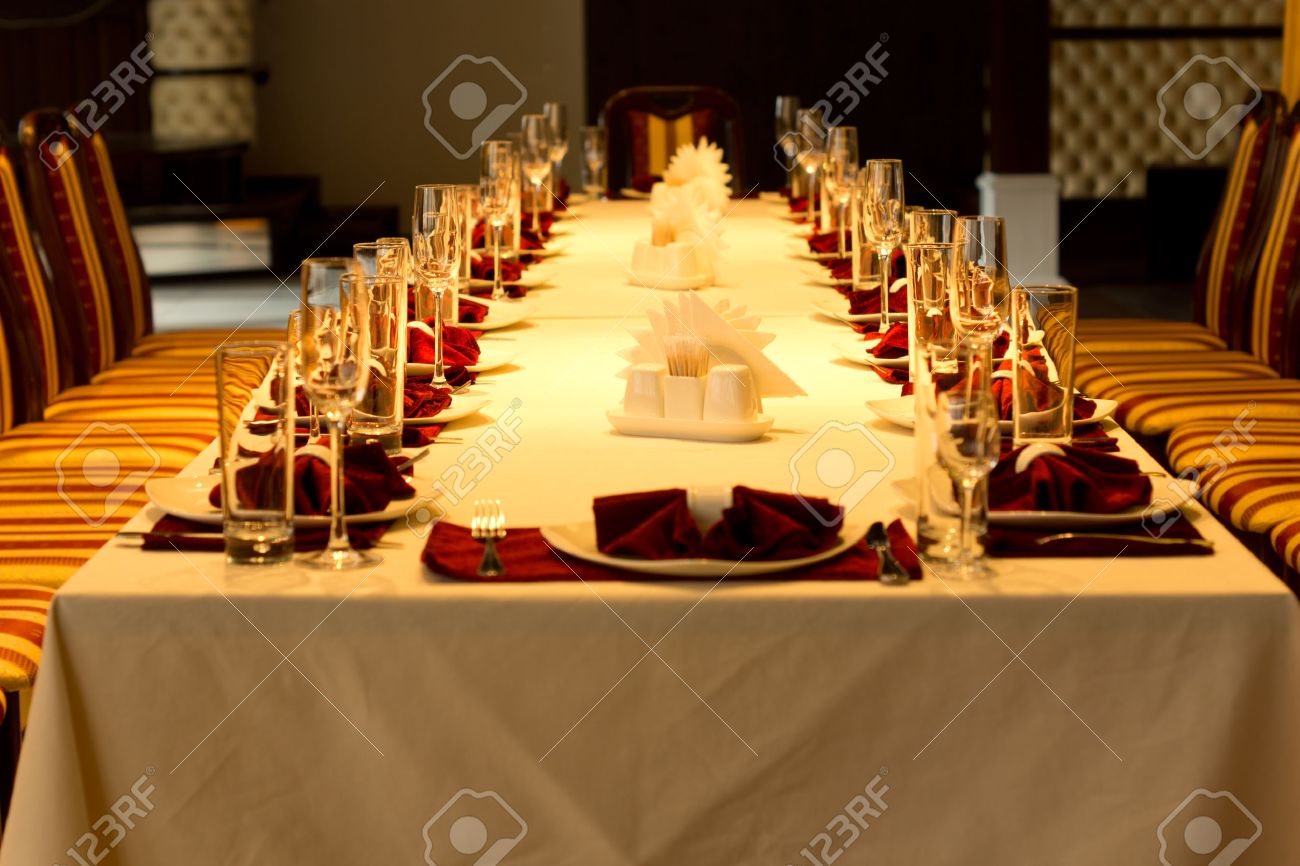 View Down The Length Of A Long Formal Dinner Table With Red Accented ... View Down The Length Of A Long Formal Dinner Table With Red Accented ...