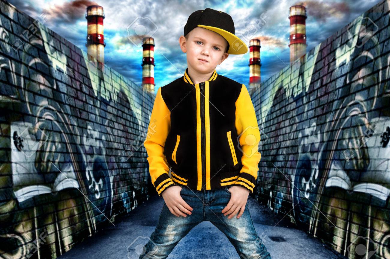 The Little Boy In The Style Of Hip Hop Children S Fashion Cap And Jacket The Young Rapper Graffiti On The Walls Cool Rap Dj Stock Photo Picture And Royalty Free Image Image