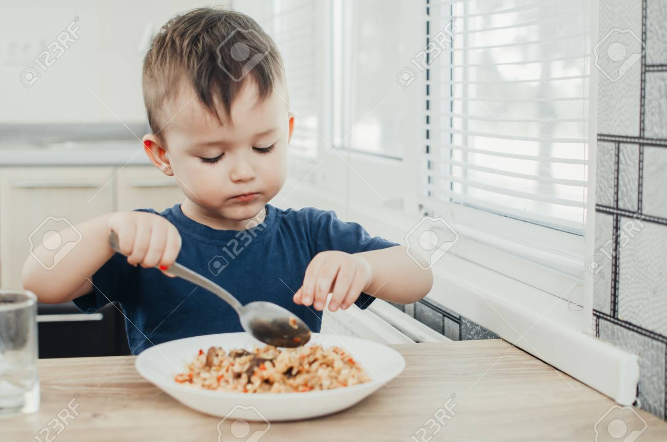 baby eating rice