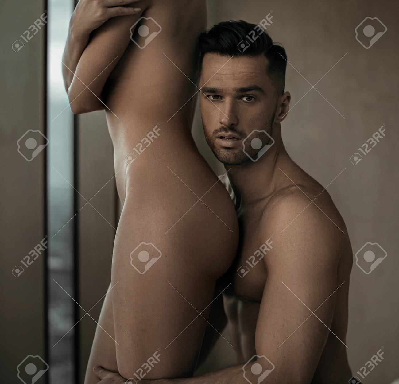 Handsome Man Hugging His Naked Wife Stock Photo, Picture And Royalty Free Image picture