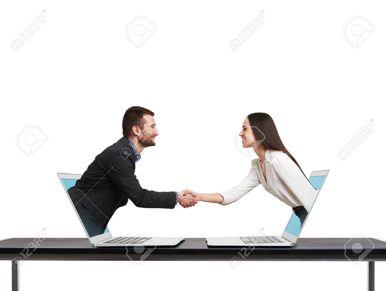 smiley businessman and businesswoman come out from laptop, shaking hands and looking at each other over white background - 39302591 smiley businessman and businesswoman come out from laptop, shaking hands and looking at each other over white background - 39302591