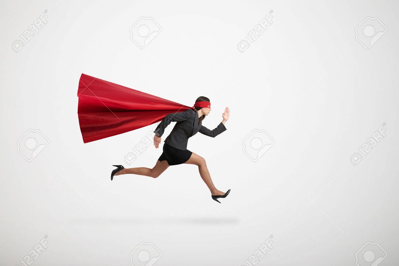 serious businesswoman wearing like superhero very fast running over light grey background - 49452696 serious businesswoman wearing like superhero very fast running over light grey background - 49452696