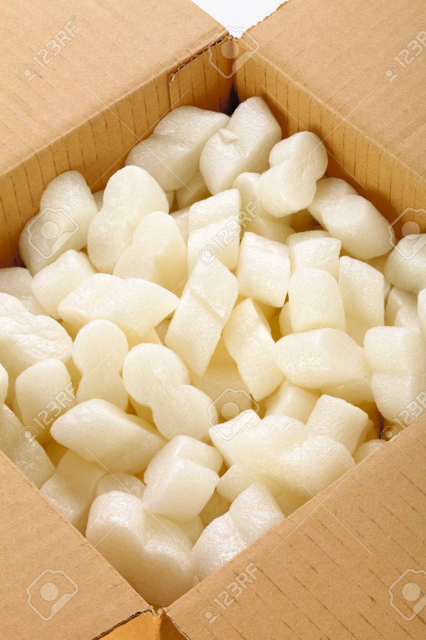 A Cardboard Box With Yellow Packing Styrofoam Peanuts Stock Photo Picture And Royalty Free Image Image 14358943