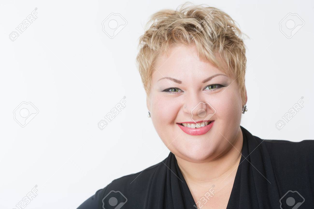 Smiling fat woman in black dress. light background - 46289435 Smiling fat woman in black dress. light background - 46289435