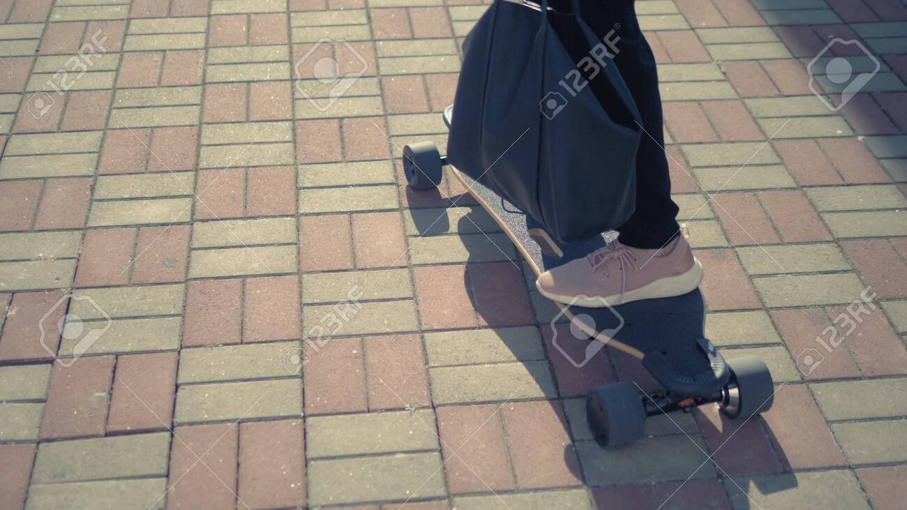 black jumpsuit with sneakers