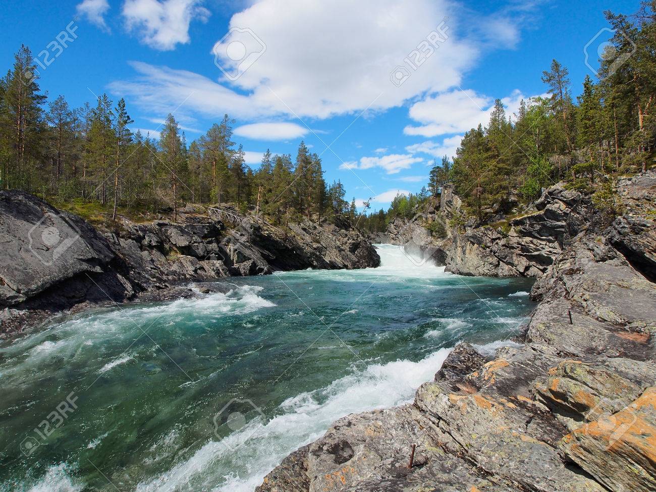 The rapidly flowing river winding through mountains, beautiful canyon in Norway, summer, sunny day - 70748339 The rapidly flowing river winding through mountains, beautiful canyon in Norway, summer, sunny day - 70748339