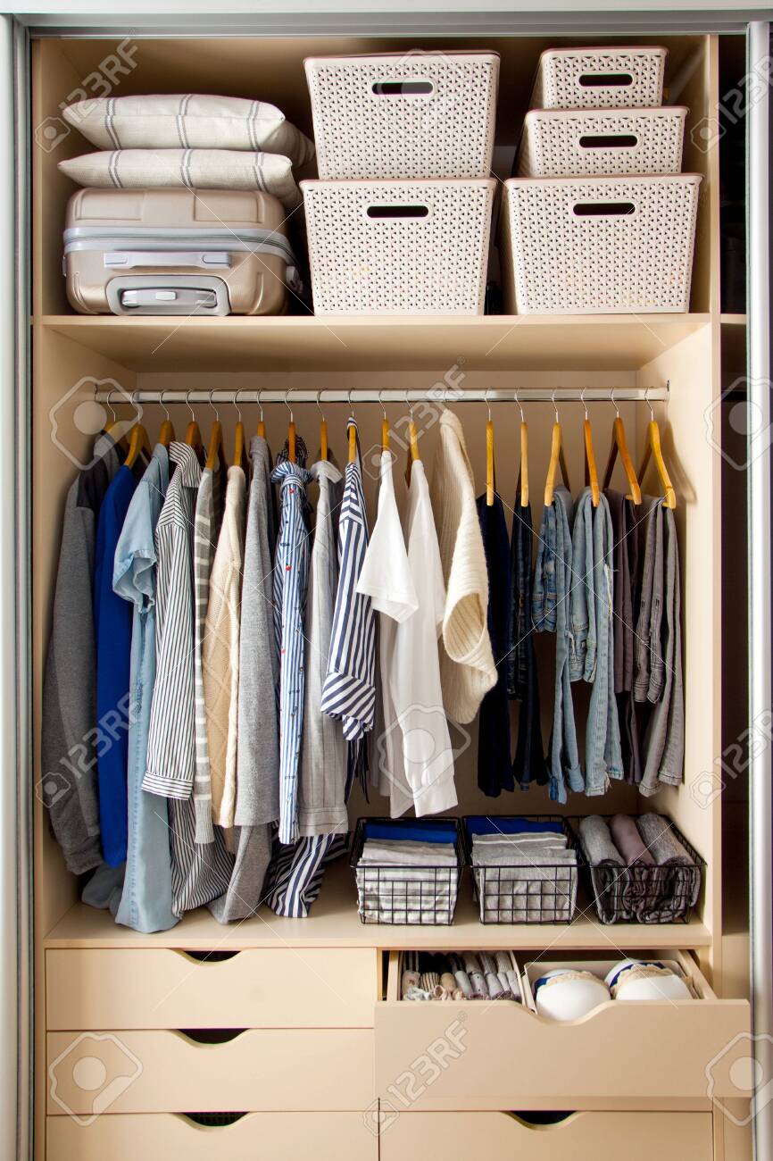 hanger storage container on Wardrobe With Perfect Order Clothes In Blue And Light Shades Stock Photo Picture And Royalty Free Image Image 145502311