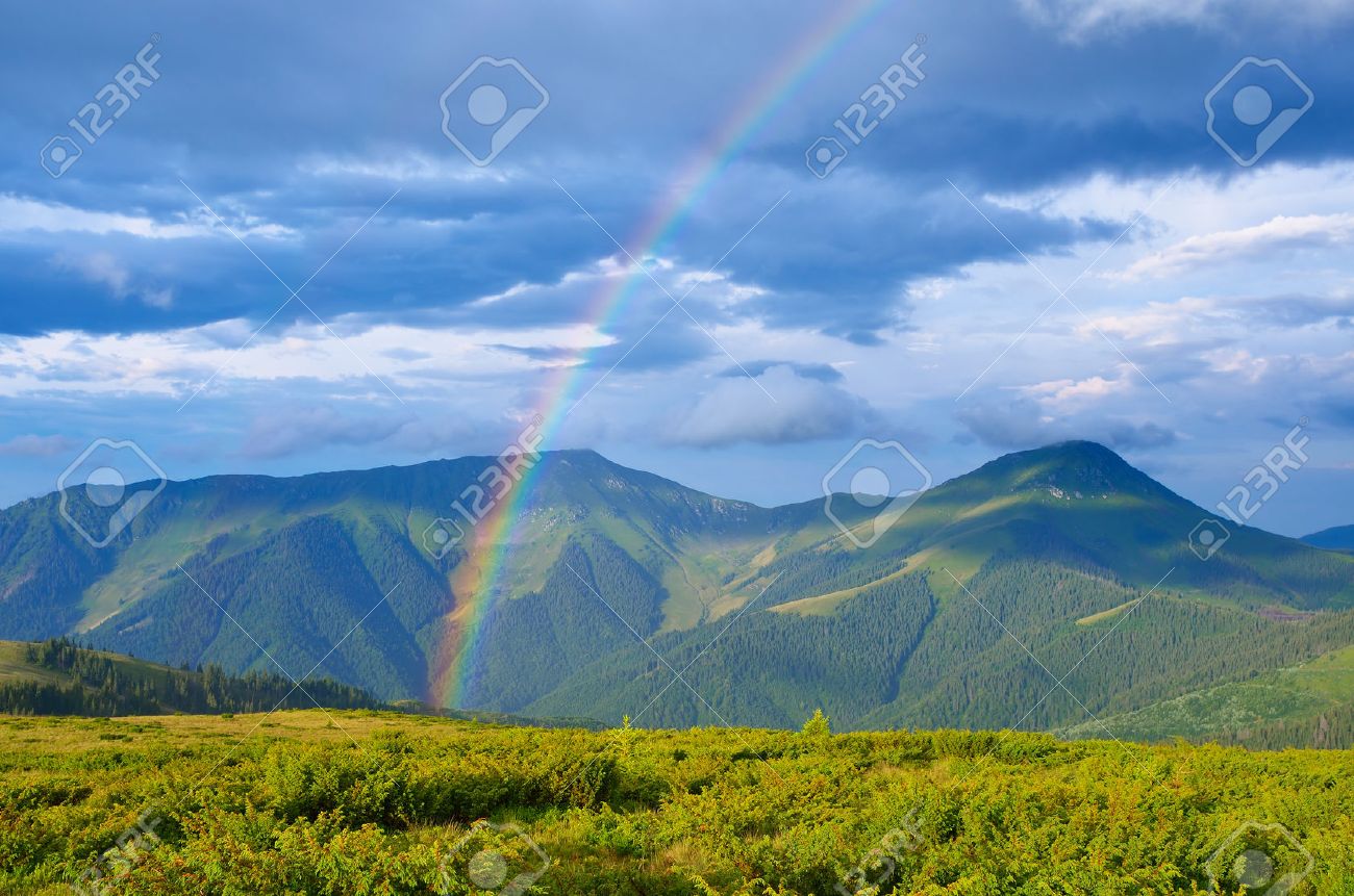 Summer landscape with a rainbow in the mountains Sunshine after the rain Beauty in nature - 30606251 Summer landscape with a rainbow in the mountains Sunshine after the rain Beauty in nature - 30606251